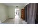 View of tiled dining room featuring open access to kitchen, providing ample natural light and neutral decor at 181 Coconut St, Punta Gorda, FL 33980