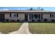 Charming single-story home with well-manicured lawn and inviting entrance at 181 Coconut St, Punta Gorda, FL 33980