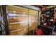 Garage door made of wood with metal brackets and shelves on the interior wall at 181 Coconut St, Punta Gorda, FL 33980