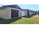 Multiple one car garages on a manicured lot at 181 Coconut St, Punta Gorda, FL 33980