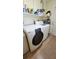 Modern laundry room with front load washer and dryer at 181 Coconut St, Punta Gorda, FL 33980