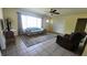 Inviting living room featuring large windows, tile flooring, and comfortable seating, great for relaxing at 181 Coconut St, Punta Gorda, FL 33980