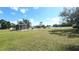 Large, sunny backyard with pool, screen enclosure, and well-maintained lawn, great for entertaining outdoors at 181 Coconut St, Punta Gorda, FL 33980