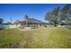 Large backyard with grassy area and pool at 20 Medalist Cir, Rotonda West, FL 33947