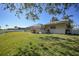 Spacious backyard with grassy area and pool at 20 Medalist Cir, Rotonda West, FL 33947