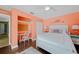 Primary bedroom with a king-size bed, built-in desk, and calming decor at 20 Medalist Cir, Rotonda West, FL 33947