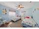Bright bedroom with twin beds, plenty of natural light, and coastal decor at 20 Medalist Cir, Rotonda West, FL 33947