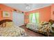 Cheerful bedroom featuring twin beds and a coastal-themed atmosphere at 20 Medalist Cir, Rotonda West, FL 33947