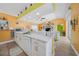 Clean kitchen with white cabinets, marble countertops and island at 20 Medalist Cir, Rotonda West, FL 33947