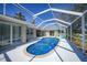 Inviting pool area with screened enclosure at 20 Medalist Cir, Rotonda West, FL 33947