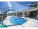 Relaxing screened pool area with patio furniture and lush landscaping at 20 Medalist Cir, Rotonda West, FL 33947