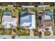 Three waterfront homes with pools and lush landscaping, seen from above at 2198 El Cerito Ct, Punta Gorda, FL 33950