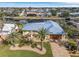 Bird's eye view of waterfront home, showcasing canal, landscaping, and neighborhood at 2198 El Cerito Ct, Punta Gorda, FL 33950