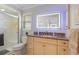 Bathroom boasts a granite vanity, lighted mirror, and walk-in shower at 2198 El Cerito Ct, Punta Gorda, FL 33950