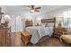Main bedroom with wood floors and ensuite bathroom access at 2198 El Cerito Ct, Punta Gorda, FL 33950