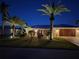 Attractive home exterior at night, highlighting landscaping and architectural details at 2198 El Cerito Ct, Punta Gorda, FL 33950