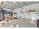 Large garage with ample storage, workbench, and epoxy flooring at 2198 El Cerito Ct, Punta Gorda, FL 33950