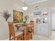 Charming kitchen nook featuring a white built-in cabinet and wood table at 2198 El Cerito Ct, Punta Gorda, FL 33950