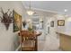 Bright kitchen nook with built-in white cabinetry and wood table at 2198 El Cerito Ct, Punta Gorda, FL 33950