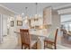 Kitchen boasts a breakfast bar, tile backsplash, and stainless steel appliances at 2198 El Cerito Ct, Punta Gorda, FL 33950