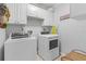 Laundry room with washer, dryer, and ample cabinet storage at 2198 El Cerito Ct, Punta Gorda, FL 33950