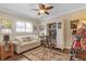 Home office with built-in shelving and comfortable seating at 2198 El Cerito Ct, Punta Gorda, FL 33950