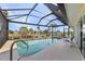 Relaxing screened-in pool with canal views and lounge chairs at 2198 El Cerito Ct, Punta Gorda, FL 33950