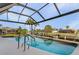 Inviting screened-in pool with canal views at 2198 El Cerito Ct, Punta Gorda, FL 33950