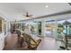 Relaxing sunroom with pool view, wicker furniture, and sliding glass doors at 2198 El Cerito Ct, Punta Gorda, FL 33950