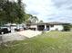 Large backyard with patio, RV parking and grassy area at 28301 N Twin Lakes Dr, Punta Gorda, FL 33955