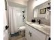 Modern bathroom with granite countertop, white cabinets and walk-in shower at 28301 N Twin Lakes Dr, Punta Gorda, FL 33955