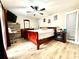 Spacious bedroom with wood flooring and a large sleigh bed at 28301 N Twin Lakes Dr, Punta Gorda, FL 33955