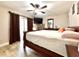 Bright bedroom with wood flooring, large bed, and access to a patio at 28301 N Twin Lakes Dr, Punta Gorda, FL 33955