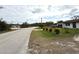 Single-story home with a two-car garage and palm trees at 28301 N Twin Lakes Dr, Punta Gorda, FL 33955
