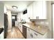 Modern kitchen with granite countertops and white cabinets at 28301 N Twin Lakes Dr, Punta Gorda, FL 33955
