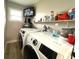 Laundry room with washer, dryer, and ample storage space at 28301 N Twin Lakes Dr, Punta Gorda, FL 33955