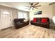 Spacious living room with large windows and a comfortable seating area at 28301 N Twin Lakes Dr, Punta Gorda, FL 33955