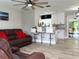 Open living room with kitchen island and modern flooring at 28301 N Twin Lakes Dr, Punta Gorda, FL 33955
