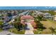 Expansive aerial view of a waterfront community with colorful townhomes and private boat docks at 3329 Purple Martin Dr # 113, Punta Gorda, FL 33950