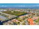 Panoramic aerial view of a large community of homes with waterways and boat docks at 3329 Purple Martin Dr # 113, Punta Gorda, FL 33950