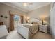 Charming bedroom with neutral tones and a large window with natural light and plush furnishings at 3329 Purple Martin Dr # 113, Punta Gorda, FL 33950
