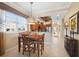 Charming dining area with natural light and a view into the modern kitchen at 3329 Purple Martin Dr # 113, Punta Gorda, FL 33950