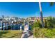 Waterfront views of a private dock, boat lift, and colorful waterfront homes at 3329 Purple Martin Dr # 113, Punta Gorda, FL 33950