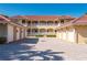Inviting two-story condo building showcases a red tile roof, white railings, and well-manicured landscaping at 3329 Purple Martin Dr # 113, Punta Gorda, FL 33950