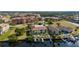 Waterfront two-story condo featuring a private boat dock, lush landscaping, and community pool at 3329 Purple Martin Dr # 113, Punta Gorda, FL 33950