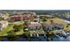 Waterfront two-story condo featuring a private boat dock, lush landscaping, and community pool at 3329 Purple Martin Dr # 113, Punta Gorda, FL 33950