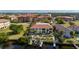 Waterfront condo featuring a private boat dock, lush landscaping, and a shared community pool at 3329 Purple Martin Dr # 113, Punta Gorda, FL 33950