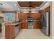 Beautiful kitchen featuring stainless steel appliances, granite countertops, and seamlessly flowing to the dining area at 3329 Purple Martin Dr # 113, Punta Gorda, FL 33950