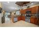 Well-equipped kitchen featuring stainless steel appliances, granite countertops, and seamlessly flowing to the living area at 3329 Purple Martin Dr # 113, Punta Gorda, FL 33950