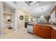 Open kitchen with granite countertops, stainless steel dishwasher, and a view of the living area and bathroom at 3329 Purple Martin Dr # 113, Punta Gorda, FL 33950